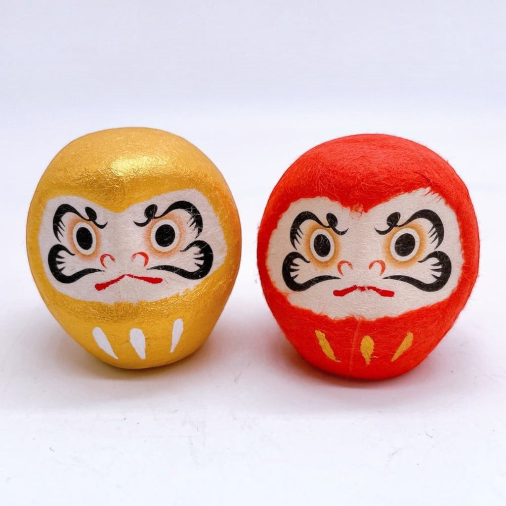 Twinkle Glory Japanese paper Daruma heads in gold and red with traditional hand-painted facial features