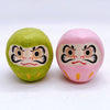 Twinkle Glory Japanese paper Daruma heads in green and pink with traditional hand-painted facial features