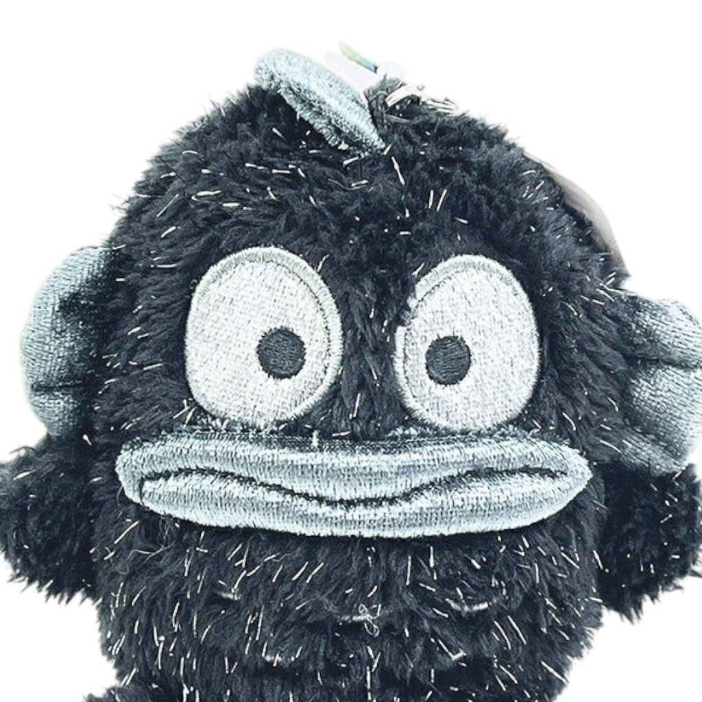 Twinkle Glory Sanrio Hangyodon plush keychain featuring a soft black fuzzy character with metallic blue accents.