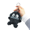 Twinkle Glory Sanrio Hangyodon plush keychain in black fuzzy polyester with a silver aluminium carabiner attachment