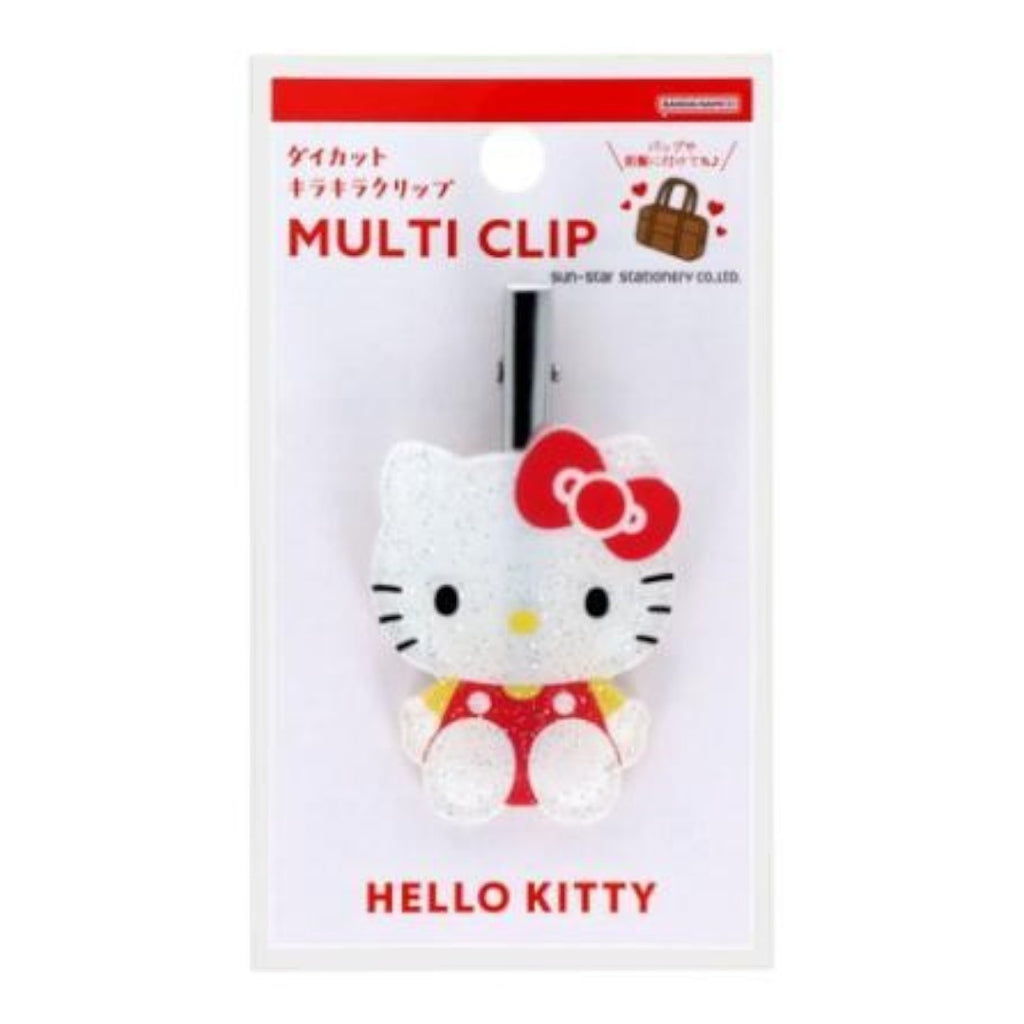 Twinkle Glory Hello Kitty die-cut hair clip with a shimmering glitter finish and iconic red bow on retail packaging