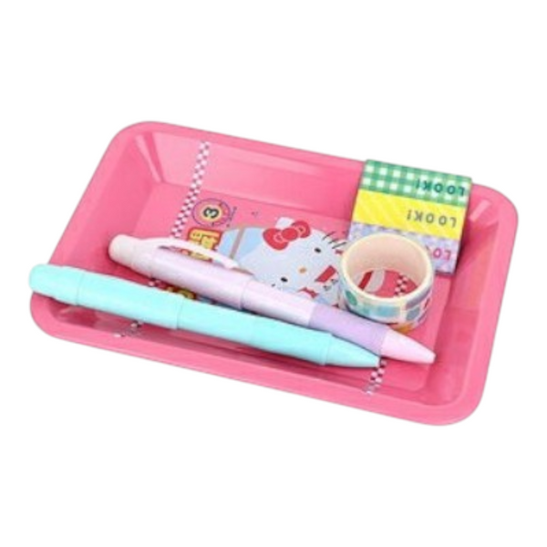 Twinkle Glory pink Hello Kitty metal pen tray holding stationery items like pens and washi tape on a white background