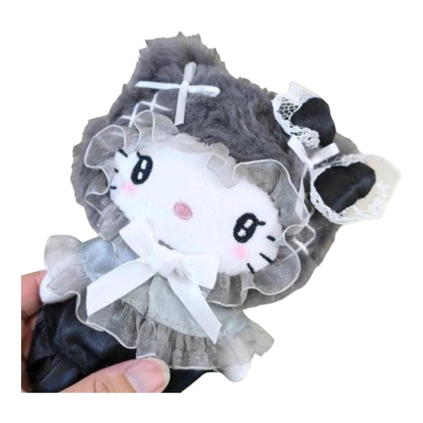 Twinkle Glory Hello Kitty plush pouch in black with a fluffy cape, lace trim, and a decorative bow.