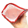 Twinkle Glory Sanrio Hello Kitty red and white polyethylene zippered pouch held in hand