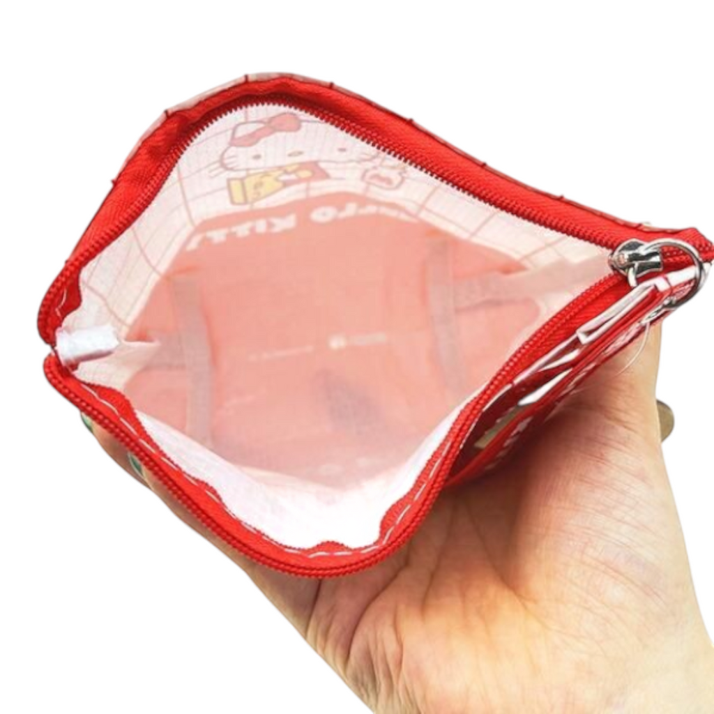 Twinkle Glory Sanrio Hello Kitty red and white polyethylene zippered pouch held in hand