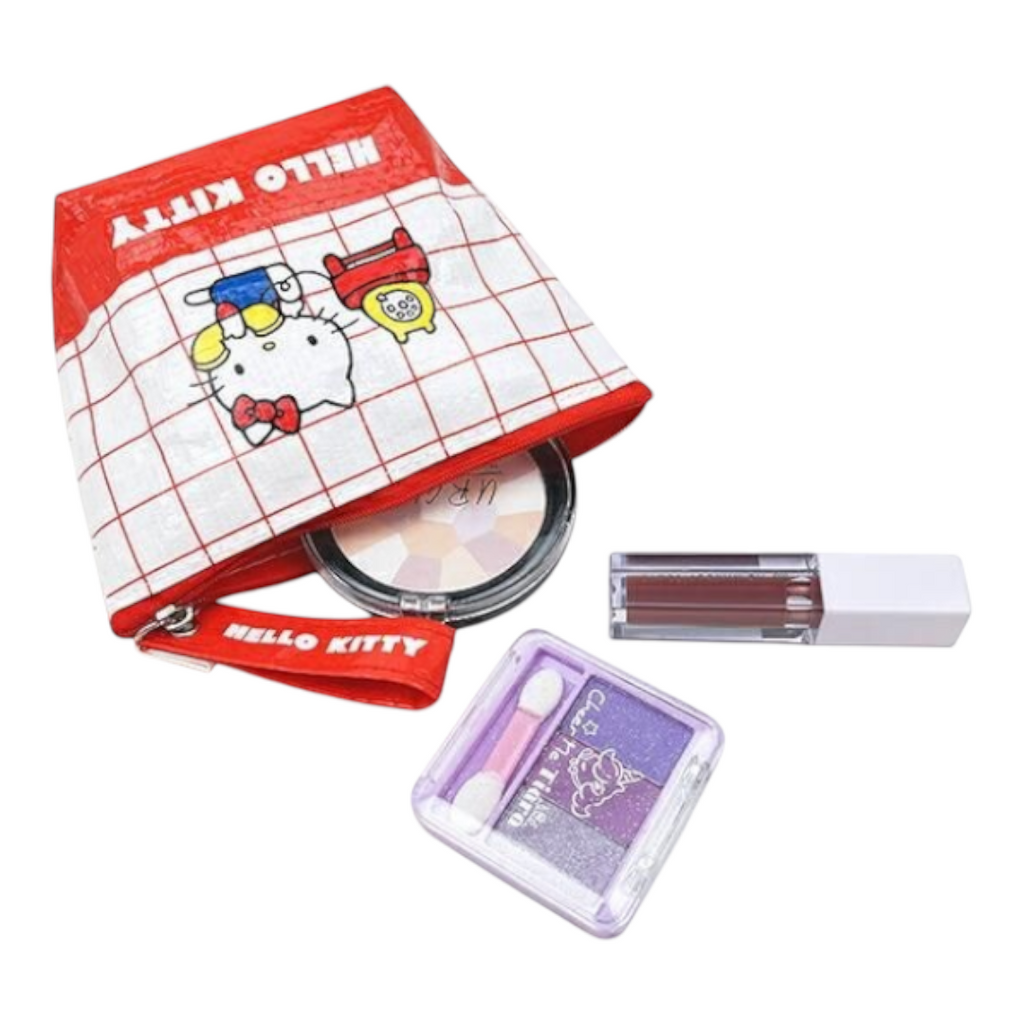 Twinkle Glory Hello Kitty polyethylene pouch with red grid pattern, holding cosmetics like powder and lipstick.