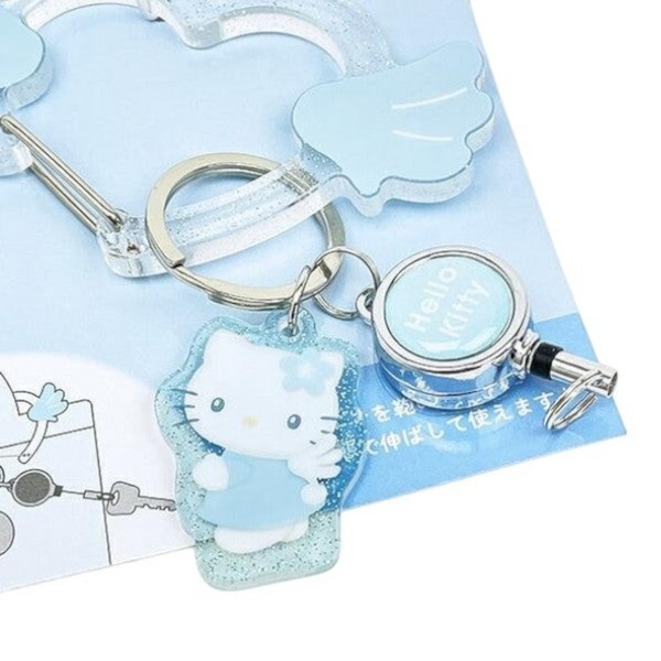 Twinkle Glory Hello Kitty retractable carabiner reel clip in glittery light blue acrylic with angel wing design