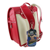 Twinkle Glory Demon Slayer Inosuke PVC key case with retractable reel attached to a red and white school backpack