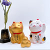 Twinkle Glory hand-painted porcelain Japanese lucky cat figurines in gold and white with traditional calligraphy