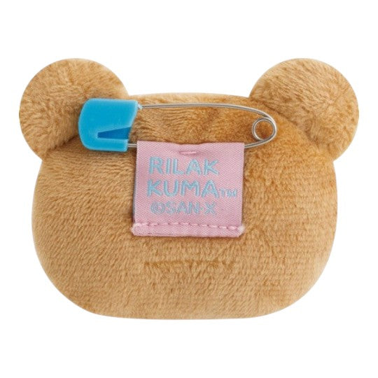 Twinkle Glory San-X Korilakkuma plush badge featuring a soft brown bear head with a blue safety pin attachment