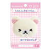 Twinkle Glory San-X Korilakkuma plush badge featuring a white bear with squeezed eyes on a pink gingham backing card