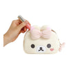 Twinkle Glory San-X Korilakkuma plush pouch with a soft cream exterior, pink bow, and built-in mirror for cosmetics.