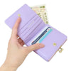 Twinkle Glory Sanrio Kuromi bifold wallet in purple synthetic leather with a gold clasp and card slots