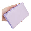 Twinkle Glory light purple Kuromi zipper wallet with embossed character pattern held in a hand