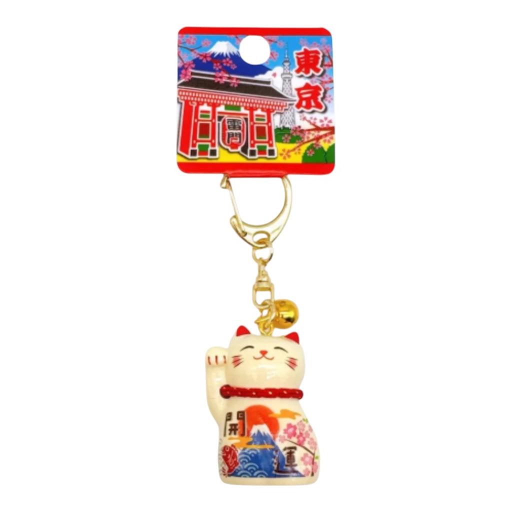 Twinkle Glory Yakushigama Maneki-Neko lucky cat bag charm with Mount Fuji and cherry blossom design on a display card