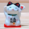 Twinkle Glory Yakushigama mini ceramic lucky cat figurine with black and white glaze and traditional kanji script
