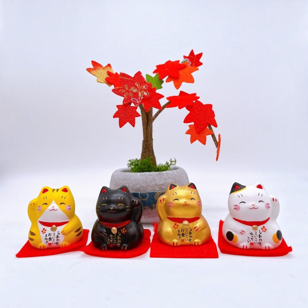 Twinkle Glory set of four Yakushigama mini lucky cats in yellow, black, gold, and calico on red mats with maple tree