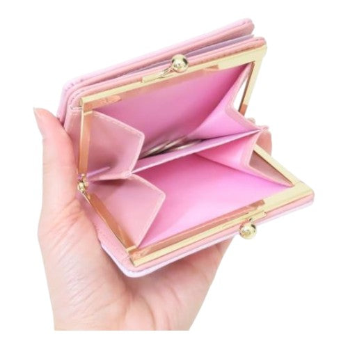 Twinkle Glory Sanrio My Melody pink bifold wallet with gold clasp closure held in hand