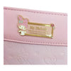 Twinkle Glory Sanrio My Melody bifold wallet in pastel pink with a decorative gold metal plaque and character detail.