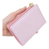 Twinkle Glory light pink My Melody zipper wallet with embossed character pattern held in a hand