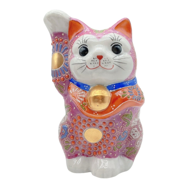 Twinkle Glory Japanese Kutani pink ceramic lucky cat figurine with a raised paw and golden bell for good fortune.