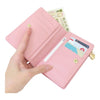 Twinkle Glory pink My Melody bi-fold wallet held in hand showing card slots and cash compartment