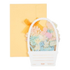Twinkle Glory Sanrio Pompompurin greeting card featuring a pastel floral basket design with a yellow envelope