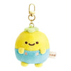 Twinkle Glory San-X Pucchy plush keychain with yellow head, blue overalls, and gold clip on a white background
