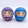 Twinkle Glory Japanese paper Daruma heads in purple and blue with traditional hand-painted facial features