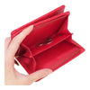 Twinkle Glory red Hello Kitty zipper wallet held in hand showing the open interior coin pouch compartment