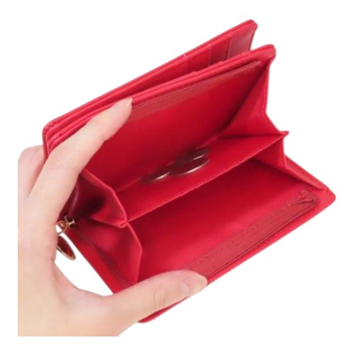 Twinkle Glory red Hello Kitty zipper wallet held in hand showing the open interior coin pouch compartment