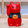 Twinkle Glory Yakushigama red porcelain Maneki-Neko lucky cat figurine with a dark collar and gold accents
