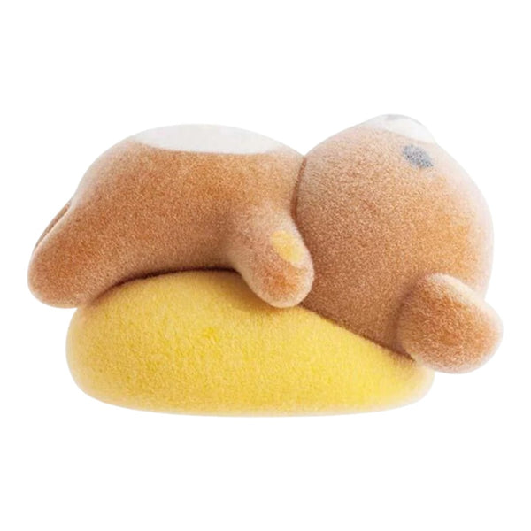 Twinkle Glory San-X Rilakkuma flocked bear figure lying on a yellow cushion, featuring a soft velvety texture.