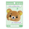 Twinkle Glory San-X Rilakkuma plush badge featuring a brown bear with a puzzled expression on a display card