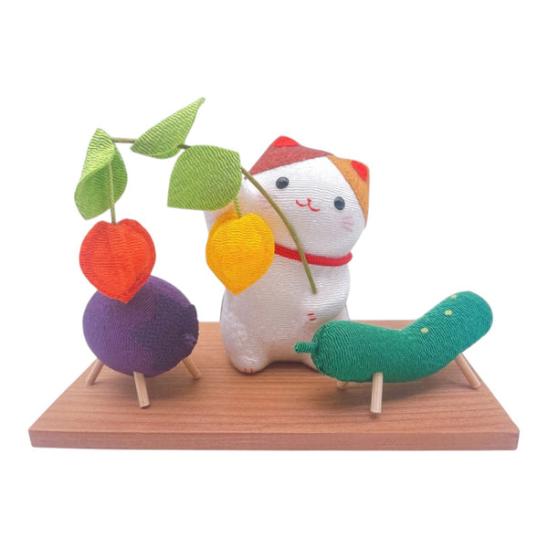 Twinkle Glory Ryukodo calico cat fabric figurine with vegetable offerings on a wooden tray display