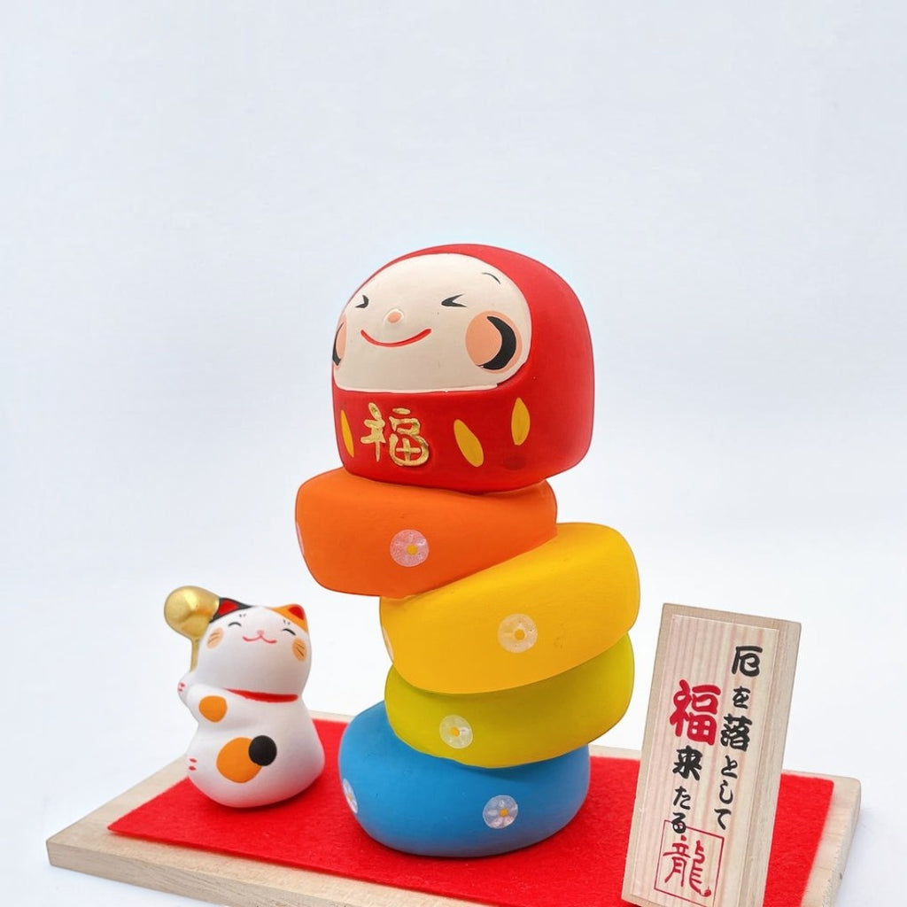 Twinkle Glory Ryukodo porcelain lucky cat and colorful Daruma Otoshi stacking game set with wooden sign and red cloth