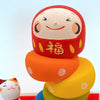 Twinkle Glory Ryukodo porcelain Daruma Otoshi stacking game with a hand-painted red Daruma head and colorful base