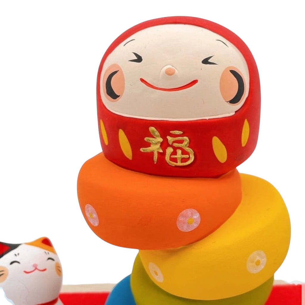 Twinkle Glory Ryukodo porcelain Daruma Otoshi stacking game with a hand-painted red Daruma head and colorful base