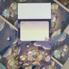 Twinkle Glory San-X Sumikko Gurashi campfire memo pad with illustrated characters in a cozy night scene