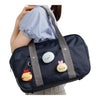 Twinkle Glory San-X Sumikko Gurashi Ebiten no Shippo plush badge attached to a navy blue school bag