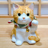 Twinkle Glory Yakushigama porcelain tiger-striped Maneki Neko cat figurine with a raised paw and decorative bell