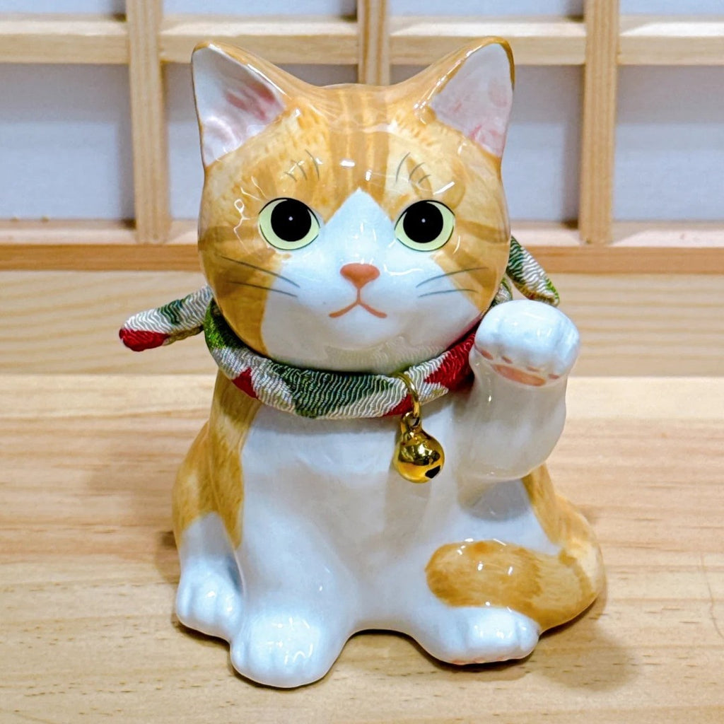 Twinkle Glory Yakushigama porcelain tiger-striped Maneki Neko cat figurine with a raised paw and decorative bell