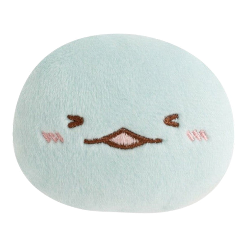 Twinkle Glory San-X Sumikko Gurashi Tokage plush badge in soft light blue polyester with a shy happy expression