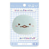 Twinkle Glory San-X Sumikko Gurashi Tokage plush badge featuring a shy happy blue lizard character on display card