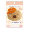 Twinkle Glory San-X Sumikko Gurashi Tonkatsu plush badge with an orange cap and beard on a branded display card