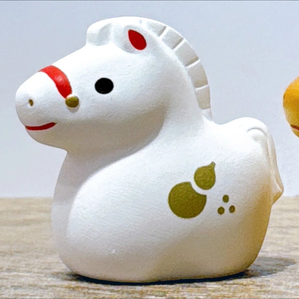 Twinkle Glory white ceramic horse zodiac figurine with red and gold accents and a gourd motif