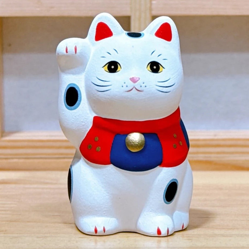 Twinkle Glory white Yakushigama Maneki-Neko porcelain lucky cat figurine with red and blue accents