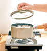 Pastel Colour Stove Top Pot on a gas stove