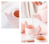 A pot pouring water into a cup from the Pink Cute Sea Creature Ceramic Tea Set