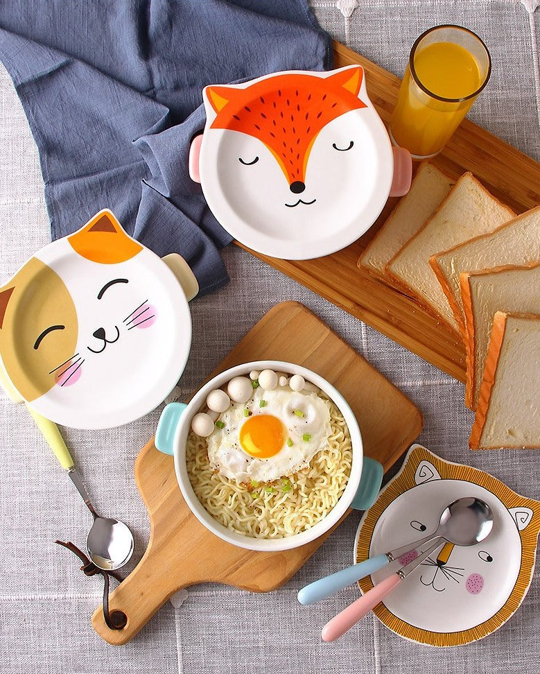 A display of several Cartoon Animal Ceramic Bowls with one holding an egg ramen meal